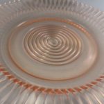 Petalware pink depression glass plate close up